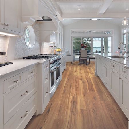 stone kitchen countertops in a large bright kitchen with wood floors